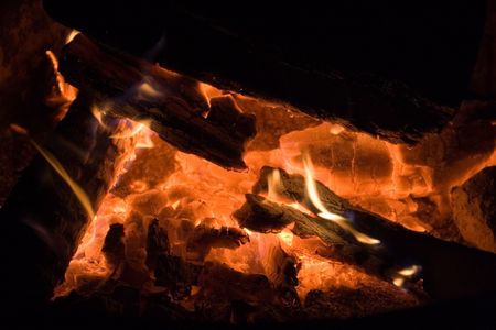 Very hot camp fire with fire and nice hot coals at night