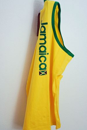 Jamaica tank top on a hook on a white wallの写真素材