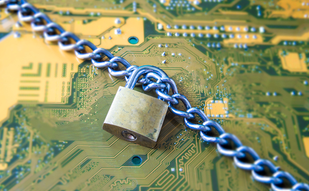 Data Security Encryption Protection Concept with Metallic Padlock chained over electronic circuit board background.の写真素材