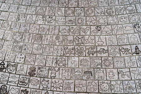 Public footpath near Toyama Castle, Toyama town, Japan -  showing various drawing engraved on it, supposingly draw by children.の写真素材