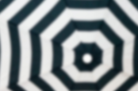Abstract background : Blurred image of Black and white octagonal pattern on umbrella.