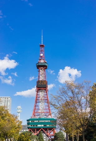 The Sapporo TV Tower in Odori Park. Beautiful blue sky day in an autumn season with unknown tourists around the park.のeditorial素材