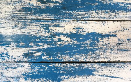 Grunge texture : Old wooden table painted with blue and white color, some color peeled off created unique texture.の写真素材