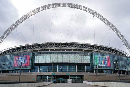 London, UK - March 8, 2018 : The screen in front of New Wembley Stadium shows England and Italy icons on it.のeditorial素材