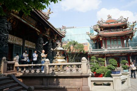 Taipei, Taiwan - April 19, 2018 : Unknown people praying inside LONGSHAN Temple.