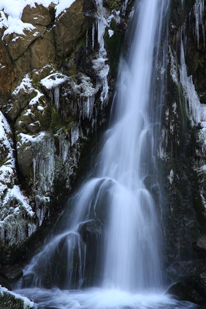 Waterfall in winter clothesの写真素材