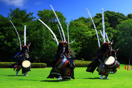 Performers in traditional Japanese costume at a cultural event.の写真素材