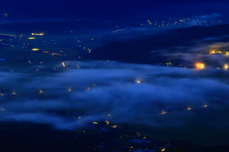 Aerial view of foggy valley at night, Chiang Mai, Thailandの写真素材