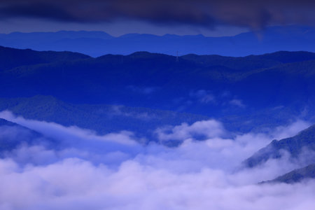 Mountains and clouds in the blue sky, closeup of photoの写真素材