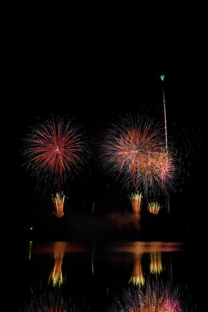 Beautiful colorful firework display for celebration happy new year and merry christmasの写真素材