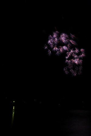 Colorful fireworks of various colors over the seaの写真素材