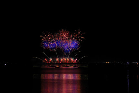 Colorful fireworks of various colors over the sea, Pattaya, Thailand