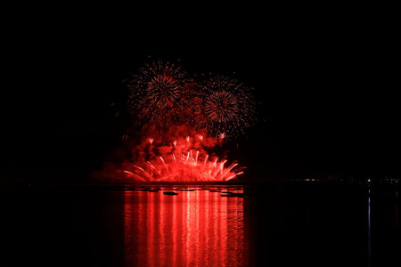 Colorful fireworks on the black sky background, celebration new year.