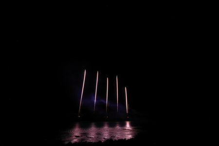 Colorful fireworks on the black sky background, celebration and anniversary conceptの写真素材