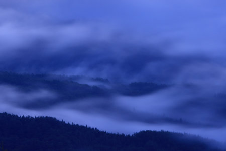 Foggy morning in the mountains. Landscape with a beautiful sky