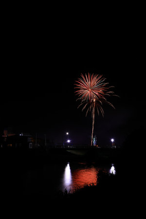 Colorful fireworks on the black sky background, celebration and anniversary concept