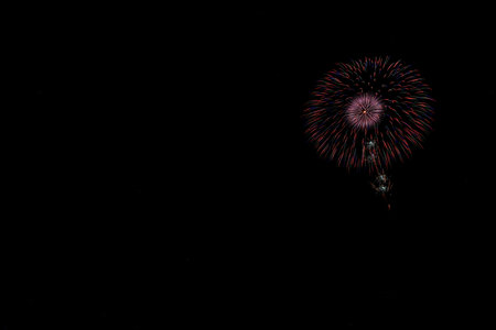 Colorful fireworks on the black sky background, celebration and anniversary conceptの写真素材