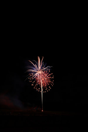 Colorful fireworks on the black sky background, celebration and anniversary conceptの写真素材