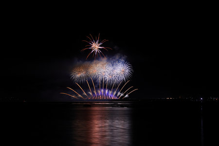 Colorful fireworks on the black sky background, celebration and anniversary concept