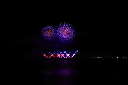 Colorful fireworks on the black sky background, celebration and anniversary concept