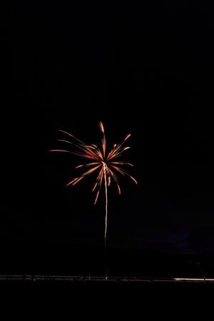 Colorful fireworks on the black sky background, celebration and anniversary concept