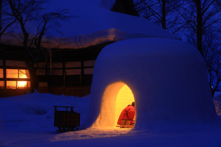 Tourists visit the snow igloo in Shirakawa-go, Japan.