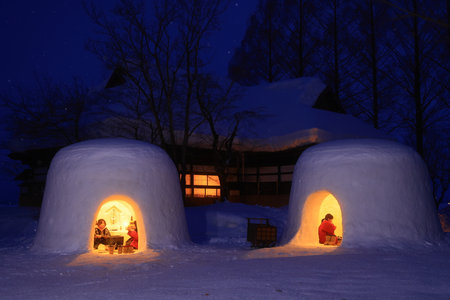 Tourists visit the snow igloo in Shirakawa-go, Japan.
