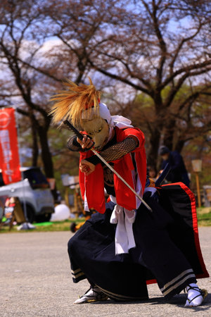 The image shows a person in a costume performing a show.の写真素材