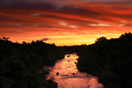 Sunset over a river in the north of Thailand, taken in the evening
