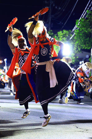 Unidentified dancers are performing traditional dance in the parade.