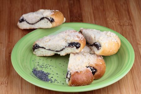 Czech traditional wedding cakes with poppy seeds on green plate.の写真素材
