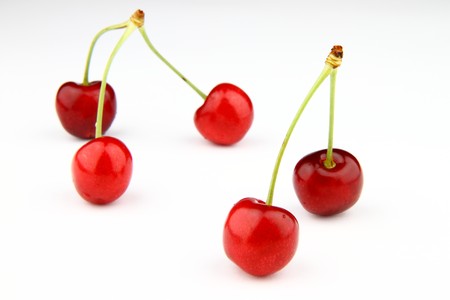 Five fresh cherries isolated on white back background.  Five cherries = Five stars.の写真素材
