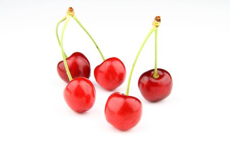 Five fresh cherries isolated on white back background.  Five cherries = Five stars.の写真素材