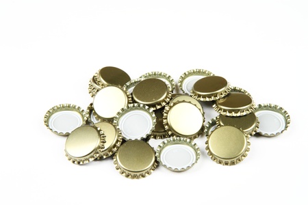 Many beer bottle caps on white background.の写真素材