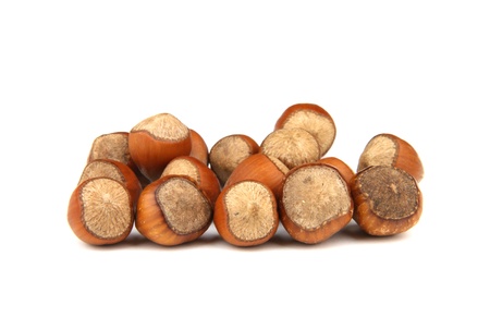 A handful of hazelnuts on a white background.の写真素材