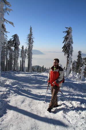 Hiker on the snow  - beautiful winter day in mountain.の写真素材