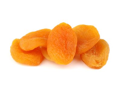 Few dry apricots on white background の写真素材
