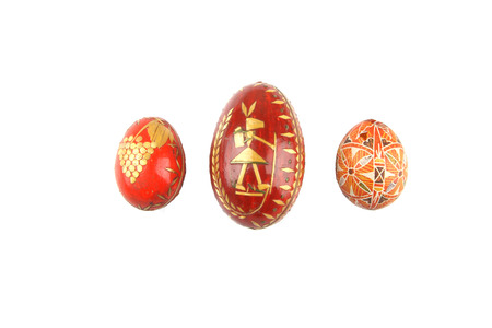 Old traditional handmade Easter eggs from years 1944 on white background.の写真素材