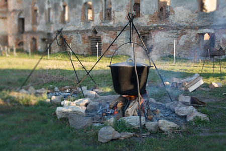A large pot on the fire sharp focus on the center with circular out of focusの写真素材