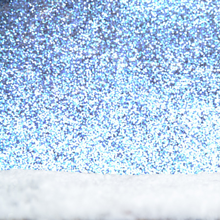 snow flakes on bottom side, abstract fall of snow and blue colored backgroundの写真素材
