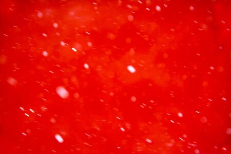 white snow on red becgroundの写真素材