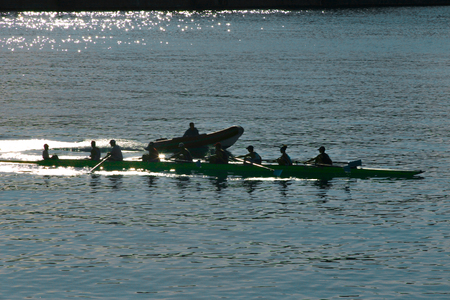 two people rowing on a riverの写真素材