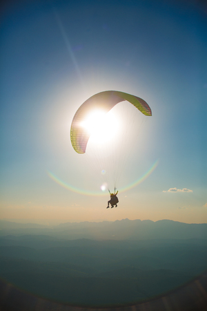 Paragliding into the sunset in Brazilの写真素材