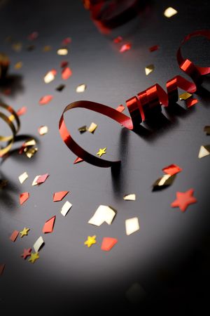 Holiday background, red ribbon on blackの写真素材
