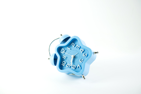 alarm clock blue on white backgroundの写真素材