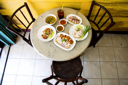 Fried chicken and Boiled chicken, Bitter soup with rice delicious breakfast prepared on the table to eat, Fast Food commonly eaten in the countries of Thailandの写真素材