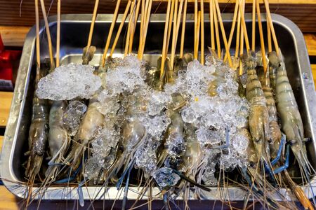 shrimp skewers to grilled dish that is roasted on the stove, it is delicious and beneficial to the body, popular for sale in the market or seafood restaurantの写真素材