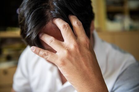 Young men were headache and felt uneasyの写真素材