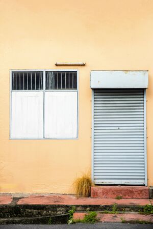 Door, window and dark Concrete wall old retro look, concrete suitable for the assembly or the use of an Idea copy spaceの写真素材