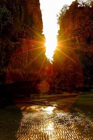 The light from the sun shining through the mountains